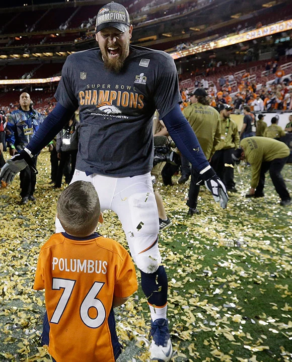 Tyler Polumbus and his son after Super Bowl 50